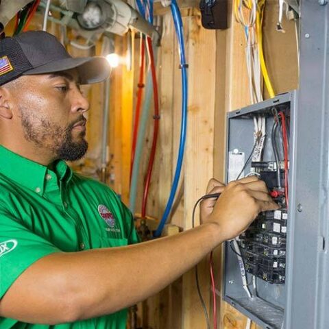 Cooper electrician wiring a residential electrical panel